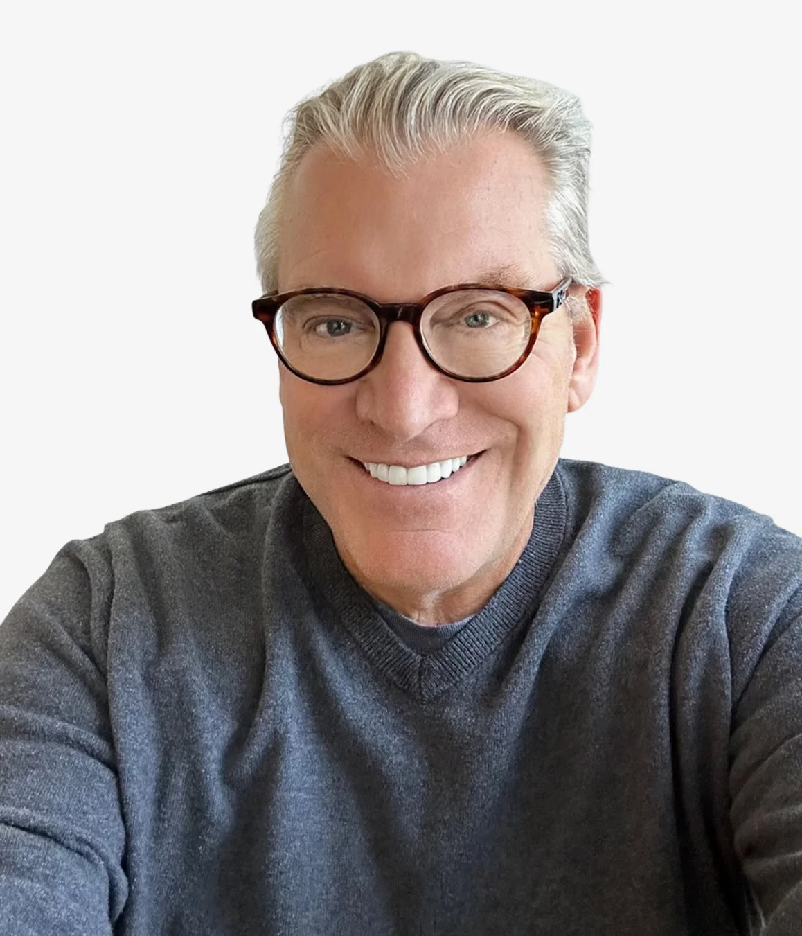 Smiling senior man with gray hair and glasses in a casual sweater.