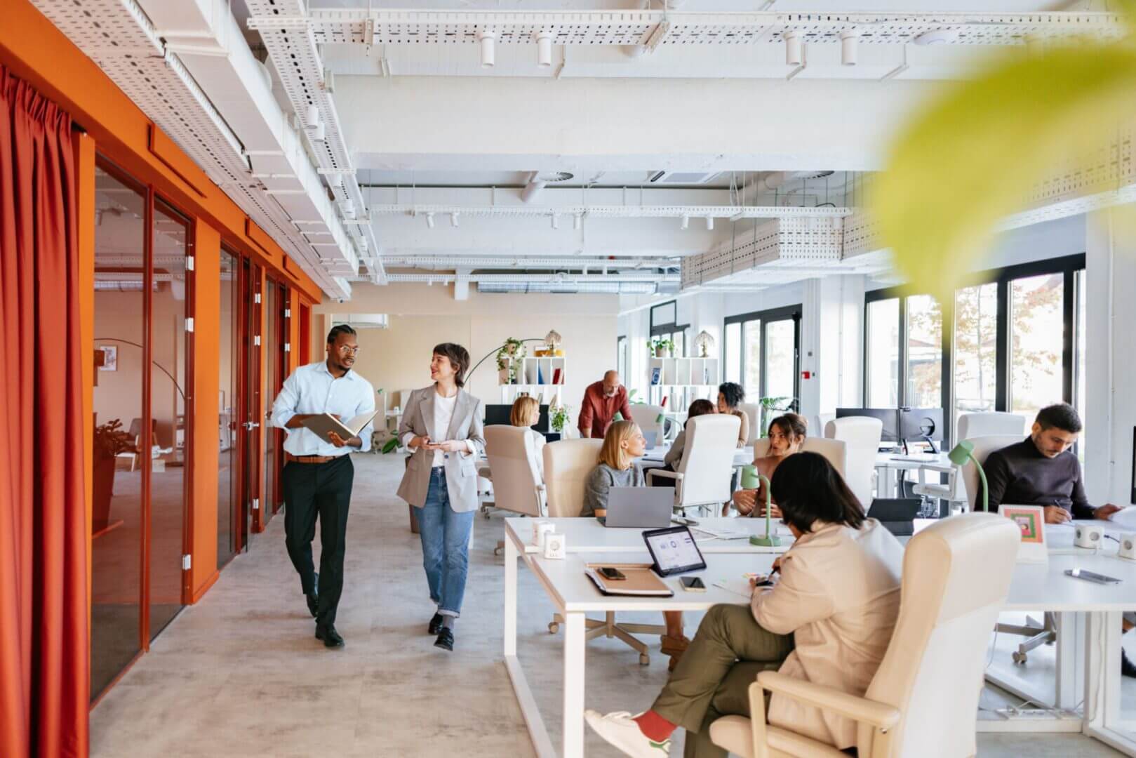 Open-plan office with people working collaboratively.